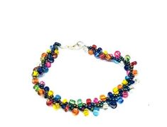 Add some color to your accessory collection with this stunning beaded bracelet. The striking combination of colorful beads gives it a unique and eye-catching look, perfect for any fashion-forward individual. The bracelet comes in two different sizes and is secured with a clasp closure for easy wear. Its charm type is a beautiful bead that adds an extra touch of elegance. Ideal for both casual and formal events, this bracelet is sure to make a statement. Easy Wear, Gift Registry, Beaded Bracelet, Formal Event, Fashion Forward, Beauty Book, Jewelry Bracelets, Accessory Gift, Beaded Bracelets