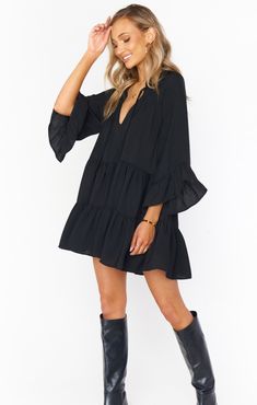 This flirty and flowy black mini dress has a tiered skirt and a tie front detail making it a boho dream! Soft ruffles along the 3/4 sleeves and bottom hem give a feminine touch. Chic Style Inspiration, Cute Thanksgiving Outfits, Thanksgiving Outfit Ideas, Dress For Petite Women, Mini Dress Black, Black Mini Dress, Modieuze Outfits, Thanksgiving Outfit, Contemporary Outfits