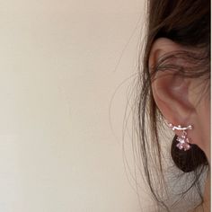 The cutest pink sakura cherry blossom flower star ear climber, ear crawler, ear stud earrings, delicate dainty beauty handmade of pink cz crystal and 14K Gold plated sterling silver, it shines gorgeously from every angle! Adorable girly feminine vibes, yet elegant and chic, goes perfect with everyday/occasions/bridal or bridesmaid look! Definitely a cute gifts idea. ♥ All of our jewelry are carefully handmade with delicate and exquisite details, all designed and made in Manhattan, New York. 💎 Features: ♥ Made to Order ♥ Material: 14K Gold plated sterling silver ♥ Main stone: pink crystal gemstone ♥ Side Stone: Cz crystal ♥ Push back Closure 💎 Details: ♥ Approximate Measurements: - Length: 0.45“ - Width: 0.6” ♥ Lightweight, easy to wear ♥ Nickel/Lead Free, Hypoallergenic 💎 Packing & Ship Cute Silver Flower Earrings, Dainty Pink Flower Earrings, Dainty Pink Flower-shaped Earrings, Delicate Rose Gold Ear Climbers For Gift, Delicate Rose Gold Ear Climbers As Gift, Trendy Rose Gold Flower Earrings, Dainty Pink Drop Earrings, Dainty Pink Flower Drop Earrings, Delicate Pink Flower Drop Earrings