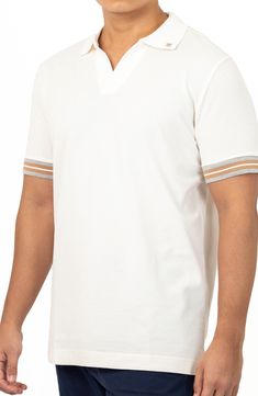 A retro-inspired Johnny collar lends trend-right style to this pure-cotton polo shirt with peeks of contrasting trim. Johnny collar Short sleeves 100% cotton Machine wash, dry flat Made in Turkey Model stats: 6'1" height, 32" waist. Model is wearing size Medium. White Casual Polo Shirt With Contrast Collar, Casual White Polo Shirt With Contrast Collar, Cotton Tops With Contrast Polo Collar, Cotton V-neck Top With Striped Collar, White Cotton Polo Shirt With Striped Collar, White Sporty Polo Shirt With Contrast Collar, White Polo Collar Top With Striped Cuffs, Cotton Polo Shirt With Striped Cuffs, Casual Collared Polo Shirt With Striped Cuffs