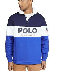 Polo Ralph Lauren LS Logo Rugby Fleece Striped Sweatshirt USA Newport Sz L. Description This blue and white Polo Ralph Lauren logo stripe rugby shirt has been crafted with cotton. Features contrasting panels, this top has a white collar, a short button front opening, a bold logo text print at the front, a logo patch at the sleeve, a kangaroo pocket and long sleeves with ribbed cuffs. Top tip: Team Polo Ralph Lauren is always the winning team Fabric: Mid-weight fleece Collared neck and Blue Long Sleeve Sweatshirt With Logo, Winter Long Sleeve Tops With Logo Detail, Casual Fleece Tops With Logo Detail, Blue French Terry Tops For Winter, Blue Fleece Tops With Embroidered Logo, Blue French Terry Long Sleeve Tops, Blue Long Sleeve Tops With Logo Detail, Navy Tops With Logo Detail For Fall, Navy Winter Tops With Logo Detail