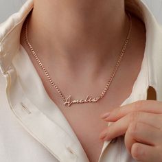 The necklace features a custom-crafted name with up to nine characters in cursive type and a classic curb chain that is perfect for beefing up your layers. Metal: 925 sterling silver; optional 18k yellow / white / rose gold vermeil Thickness: 1 mm / 0.04" Chain style: 3 mm / 0.12" silver curb chain Hypoallergenic: nickel-free materials used therefore suitable for those with metal allergies Different Lettering Styles, Necklace With Name, Handwriting Necklace, Sterling Silver Name Necklace, Cursive Script, Curb Chain Necklace, Solid Gold Necklace, Gold Name Necklace, Nameplate Necklace