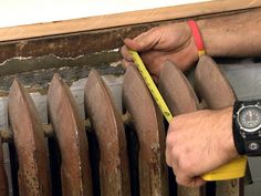 a person is working on an old radiator