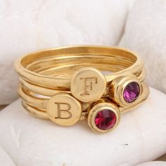 "This set of stackable rings is perfect for the mother or grandmother of two. Pair an initial and birthstone for each child. Also makes a great couple's ring, pair you and your special someone's initial and birthstone as a reminder throughout the day of the love you share. You will adore these sweet rings that add just the right amount of bling to your day. **This listing is for a set of 4 rings - 2 initial rings and 2 birthstone rings. Each ring is 24K gold vermeil and has either one letter/sym Stacked 14k Gold Rings As Gift, Stacked 14k Gold Rings For Gift, Stacked Rings In 14k Gold As Gift, Stacked Round Rings For Anniversary, Mother's Day 14k Gold Stackable Rings, Personalized Yellow Gold Stackable Round Rings, Stacked Yellow Gold Rings As A Gift, Gold Stacked Jewelry For Anniversary, Stacked Round Rings As Gift