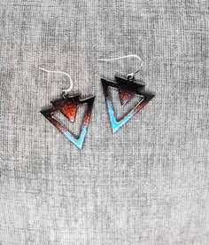 ©️Original Alaska art from BonfireDesigns907! HANDMADE IN KETCHIKAN, ALASKA! Individually hand-crafted painted glass Alaska Triangle earrings on nickel-free sterling silver ear wires. My inspiration making glass art comes from my love of nature and the many colors and moods of the woods and the ocean. Living in such an awe-inspiring place with my family feeds my creativity every day. I am always coming up with new designs and styles.  I can make custom orders too, so send me a message and let me Blue Bohemian Triangle Earrings, Bohemian Blue Triangle Earrings, Artistic Blue Jewelry For Festivals, Unique Blue Earrings For Festival, Blue Artsy Jewelry For Festivals, Artsy Blue Jewelry For Festivals, Blue Triangle Earrings For Gift, Artisan Blue Earrings With Artistic Design, Artsy Blue Earrings With Artistic Design