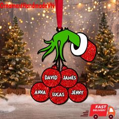 an ornament hanging from a christmas tree with the name david james and lucas jenny