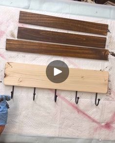 a man is working on some wood planks