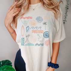 Rep the ocean wherever you go with this cute and comfortable beach inspired t-shirt! Perfect for yourself or a fellow ocean lover in your life! Also check out our darker, neutral ocean collage tshirts or our crewneck sweatshirts! Dark t-shirts: https://www.etsy.com/listing/1403410316/ocean-collage-t-shirt-dark-neutral?click_key=bc8a571e0fa7ff383ee799980b0b18739c6c7edb%3A1403410316&click_sum=e109454b&ref=shop_home_active_4 Neutral sweatshirts: https://www.etsy.com/listing/1403410476/ocean-collage-neutral-crewneck?click_key=b069810acef540421febe2ff2609c1593446da3d%3A1403410476&click_sum=11108a4f&ref=shop_home_active_2 Colorful sweatshirts: https://www.etsy.com/listing/1403410538/ocean-collage-colorful-crewneck?click_key=e00794a5eaaf4cb167d1b8d573c13635213dee5f%3A1403410538&click_sum=a3eb07ba Ocean Collage, Ocean Tshirt, Ocean Outfits, Colorful Sweatshirt, Ocean Lover, Beach Inspired, Trendy Tshirts, Hoodie Design, Comfort Colors