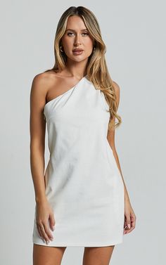 Channel your inner Greek goddess with the Mardelle Mini Dress. This stunning one-shoulder shift dress in crisp white linen will have you feeling like a summer dream. The asymmetric design adds a modern twist to this classic silhouette, while the sleeveless style keeps it effortlessly cool and perfect for those warm days or festival vibes. Whether you're heading to a casual brunch or dancing the night away, this shift dress is versatile enough to take you from day to night with ease. Embrace your Casual Festival, Red Sequin Dress, Basic Black Dress, Bachelorette Dress, Spring Maxi Dress, Neon Outfits, Navy Bridesmaid Dresses, Exude Confidence, Dress Linen