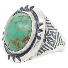 A fine vintage Navajo ring. In silver and bezel set with a large oval turquoise cabochon. Worked throughout with hand hammered decoration and liver sulfur patination to the recess. Simply a fine Old Pawn ring! Date: 20th Century Overall Condition: It is in overall good, as-pictured, used estate condition with some fine & light surface scratches and other signs of expected light wear consistent with age. Condition Details: There is some light chipping, fissures, and scratches to the cabochon. The Navajo Ring, Navajo Rings, Cabochon Ring, Vintage Navajo, Domed Ring, Turquoise Sterling Silver, Cocktail Rings, Bezel Setting, Antique Jewelry