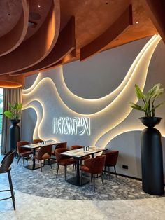 the interior of a restaurant with tables and chairs in front of a wall that reads hesperon