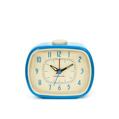 a blue and yellow alarm clock on a white background