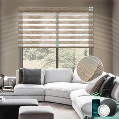 the living room is decorated in shades of grey and white, with wood blinds on the windows