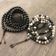 Beautiful black and mix Agate Japa Mala from Nepal. You can choose between the Black Agate mala and the Mix Agate mala necklace. A unique praying mala that can be used as a necklace or as an ornament. The mala has no clasp, you wear it over the head. The mala necklace is 42.5cm- 16.75 inch long A most have addition to your jewelry collect To see more unique Mala necklaces click the link below https://www.etsy.com/shop/AkashiJewelry?ref=seller-platform-mcnav&section_id=18307945 Enjoy Con salu Agate Meditation Bracelets With 108 Beads, Agate Bracelets With 108 Beads For Meditation, Spiritual Agate Beaded Bracelet With 8mm Beads, Adjustable Agate Mala With 8mm Beads, Beaded Agate Mala With Round Beads, Agate Beaded Bracelets With 108 Beads For Meditation, Adjustable Agate Mala With Round Beads, Spiritual Agate Mala With 108 Beads, Black Bohemian Beaded Bracelets For Meditation