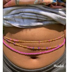 This set is comes with 3 waist beads  1 pink  1 pink, purple, gold  1 pink and gold   --- if no waist size is listed then waist bead  will default to 50 inches **If you add a clasp Please include your Waist Size . If your waist size is not listed, send me a message. This shop accepts all sizes. If don't know your waist size please choose tie on method and you can adjust it when get it to your custom size .  handmade with love  Free affirmation cards with your order  ️⚖️ Cheap Bohemian Waist Beads For Women, Summer Bohemian Beaded Body Jewelry, Adjustable Beaded Body Jewelry For Beach, Adjustable Beaded Body Jewelry For The Beach, Bohemian Beaded Body Jewelry For Beach, Bohemian Gold Body Jewelry For The Beach, Pink Waist Beads With 108 Beads As A Gift, Handmade Gold Waist Chain, Pink Tiny Beads Waist Beads For Gift