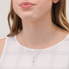 She'll wear this effortless cross pendant day after day. Fashioned in sterling silver, this precious choice features a sculpted beaded cross adorned with diamond accents - each artfully set to enhance size and sparkle. Buffed to a brilliant luster, this pendant suspends along an 18.0-inch rope chain that secures with a spring-ring clasp. Elegant Sterling Silver Cross Pendant, Elegant Sterling Silver Cross Charms And Jewelry, Elegant Sterling Silver Cross Jewelry And Charms, Diamond Accented Cross Necklace, Sterling Silver Cross Pendant Necklace, Fine Jewelry Sterling Silver Cross Necklace, Silver Pendant Cross Necklace, Fine Jewelry, Elegant Crucifix Cross Necklace With Diamond Accents, Elegant Sterling Silver Crucifix Charms