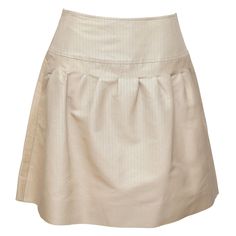 GUARANTEED AUTHENTIC VALENTINO BEIGE A-LINE PLEATED SKIRT Details: - Timeless A-line silk skirt in a khaki beige color. - Yoke waist. - Pleating. - Side zipper closure. - Unlined. Material: 80% Cotton, 20% Silk Size: 4 Measurements (Approximate laid flat, Alterations By Chanel): - Waist, 14.25" (higher waisted) - Hip, 18" - Total Length, 19" (tip of front waistline to bottom front hem) To Our Customers: - We consider it a privilege to serve as your luxury fashion concierge. Whether you are looki Silk A-line Pleated Skirt, Formal A-line Silk Bottoms, Elegant A-line Pleated Skort, Elegant Fitted Skort With Gathered Skirt, Silk A-line Bottoms For Formal Occasions, Classic A-line Skirt For Daywear, Elegant Short Length Pleated Skirt, Elegant Flared Skort With Gathered Details, Summer Formal Silk Pleated Skirt