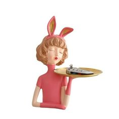 a figurine holding a tray with a record player on it's side