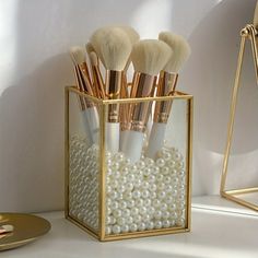 1. Elevate your vanity with the DEKAXID Golden Glamour Makeup Brush Organizer. This stylish single slot metal storage solution is perfect for keeping your favorite brushes organized and easily accessible. Effortlessly chic and durable, it's the perfect addition to any vanity, desk, dresser, or bathroom. 2. Keep your brushes organized in style with the DEKAXID Golden Glamour Makeup Brush Organizer. With its classic design and versatile functionality, this sleek metal storage solution is a must-ha Dresser Bathroom, Makeup Brush Organizer, Brush Organizer, Makeup Brush Organization, Desk Dresser, Gold Makeup, Glamour Makeup, Metal Storage, Makeup Room