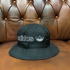 Bucket Hat By Adidas Bucket Style Breathable Eyelet Vents Wide Brim Adidas Logo Embroidery Unisex Design Adidas Original, Adidas Black, Logo Embroidery, Wide Brimmed, Adidas Logo, Black Adidas, Embroidery Logo, Unisex Design, Adidas Men