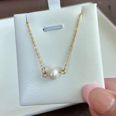 Enhance your feminine grace with our Single Pearl Necklace. Made with a dainty, cute design, this necklace will add a touch of girly elegance to any outfit. Stand out and make a statement with this unique and sophisticated accessory. 15 inches long + 2 inches ext 18K PVD gold plated stainless steel Fresh Water Pearl Pendant Non Tarnish And Water Resistant Elegant Yellow Gold Hypoallergenic Charm Necklace, Elegant Hypoallergenic Yellow Gold Charm Necklace, Elegant Hypoallergenic Round Pendant Necklace, Elegant Hypoallergenic Rose Gold Charm Necklaces, Elegant Rose Gold Hypoallergenic Charm Necklaces, Elegant Hypoallergenic Rose Gold Charm Necklace, Gold Pearl Necklace As A Gift For Her, Dainty Gold-plated Charm Necklace With Pearl Pendant, Elegant Gold Hypoallergenic Charm Necklace