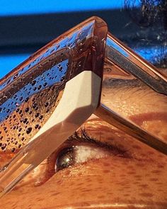 a close up of an eye with water on it