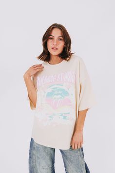 Add some groovy vibes to your wardrobe with this Rolling Stones tee! Featuring an iconic graphic and an oversized fit, this tee is perfect for music lovers and fashionistas alike. Don't miss out on this must-have piece for your collection. Details Rolling Stones graphic Oversized fit Sizing Approximate measurements: SIZE LENGTH BUST Small 29" 50" Medium 29" 52" Large 30" 54" Fabric has stretchModel is 5’8 wearing small Material 100% CottonWash with similar colorsHang dry Oversized Retro T-shirt For Spring, Relaxed Fit Graphic T-shirt For Concerts, Trendy Summer Concert T-shirt, Trendy T-shirt For Summer Concert, Relaxed Fit Short Sleeve T-shirt For Music Festival, Trendy Summer T-shirt For Concert, Trendy Short Sleeve T-shirt For Music Festival, Trendy Graphic Print Tops For Music Festival, Summer Concert Graphic Tee T-shirt