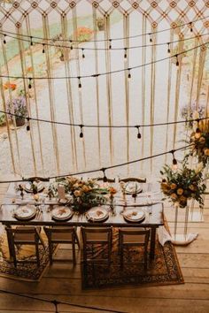 a table set up with plates and place settings