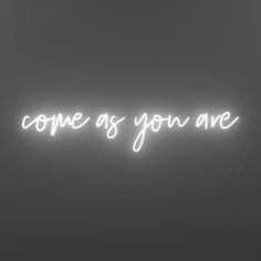 a black and white photo with the words copre as you are written in neon lights