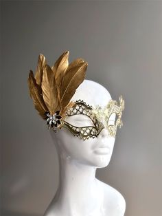 Rhinestones delicately embellish this gold women's masquerade mask, adding a touch of sparkle to your elegance. Golden feathers adorn the mask with an elegant brooch. Crafted with detail, this mask showcases the enchanting allure of gold, making you a captivating presence at any masquerade event.


Age Group/Gender - Adult/Women

Size/Type - One size fits all adults

Mask Color - Gold

Mask Material - Laser Cut Metal

Accent Material - Paint

Special Features - Feathers and a brooch Masquerade Event, Masquerade Mask Women, Golden Feather, Elegant Brooch, Metal Feather, Feather Mask, Gold Mask, Laser Cut Metal, Masks Masquerade