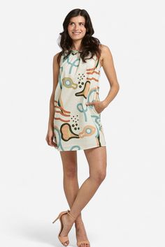 Elevate your summer wardrobe with our Camilla Abstract Print Linen Mini Dress! Made with lightweight linen, it features a high neckline, sleeveless silhouette, and convenient side-seam pockets. Pair it with our Zoe Orange Bow sandals for a casual day look or dress it up with heels for a chic night-time ensemble. Embrace the warm weather in style and comfort with this versatile piece. Made in Italy by BravaaComposition:100% LinenFit:Model 1 is wearing a size Small. Model's measurements: Height 5' Summer High Neck Beige Dress, Beige High Neck Summer Dress, Unlined Linen Dress For Day Out, Beige High Neck Dress For Summer, Casual Beige Halter Neck Sleeveless Dress, High Neck Beige Dress For Summer, Beige Summer Dresses With Side Pockets, High Neck Summer Beach Dress, High Neck Beach Dresses For Summer