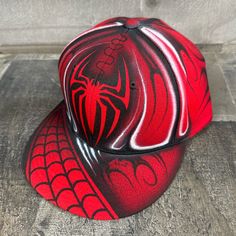 This is an airbrushed snapback hat featuring a Red Spider design.  This hat is adjustable and will fit almost anyone.  These hats are waterproof and can withstand a good soaking but they should not be washed in a washing machine or dish washer.  Thank you, Brad. Shipping is free for this item anywhere in the US. Red Flat Bill Trucker Hat For Outdoor, Red Snapback Hat For Streetwear, Red Adjustable Flat Brim Fitted Hat, Red Flat Brim Snapback Hat For Sports Events, Red Flat Bill Hat For Streetwear, Adjustable Flat Bill Red Hat, Red Adjustable Flat Bill Hat, Red Fitted Cap For Streetwear, Red Flat Brim Fitted Hat For Streetwear