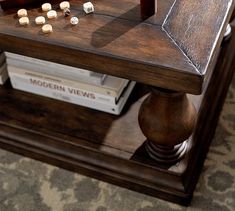 a wooden table with dices on top of it