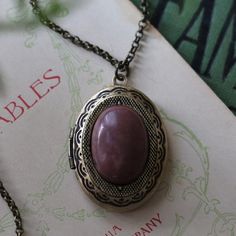 Semi-precious stone on a vintage brass, antiqued silver, or shiny silver oval locket, perfect for remembering your loved ones.  On 28 inches of antiqued brass chain. Choose from Rose Quartz or Rhodonite. I can change the chain to any length, just leave a note at checkout. Zodiac Rings, Oval Locket, Vintage Lockets, Cameo Ring, Shiny Silver, Locket Necklace, Brass Chain, Antique Rings, Luxury Jewelry