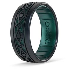 a black and green wedding band with an intricate design on the inside, in front of a white background