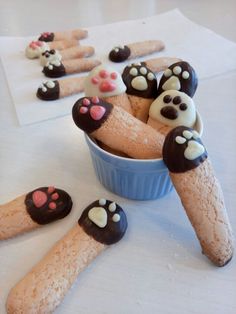 there are many dog paw shaped treats in the bowl