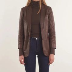 Our Women's Brown Leather Blazer Coat is an original and elegant piece that is perfect for any occasion. Whether you're dressing up for a formal event or looking to add some sophistication to your everyday outfits, this blazer coat is the perfect choice. Crafted from high-quality leather, this blazer coat is durable and built to last. The coat features a classic notch collar and two-button closure that will never go out of style. The front pockets and single chest pocket provide ample storage fo Luxury Tailored Leather Jacket For Semi-formal Occasions, Notch Lapel Blazer For Fall Parties, Business Blazer With Lapel Collar For Fall, Semi-formal Fall Blazer With Suit Collar, Brown Office Blazer, Spring Brown Blazer With Hidden Button Closure, Sleek Winter Blazer With Suit Collar, Spring Formal Brown Blazer, Elegant Fitted Brown Blazer