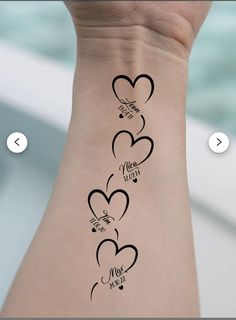 a woman's arm with three hearts and the words i love you on it