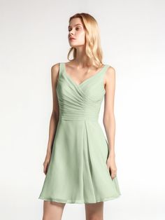 a woman in a short green dress