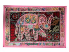 an elephant is painted on the side of a piece of cloth with flowers and leaves