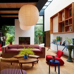 a living room filled with furniture and lots of windows