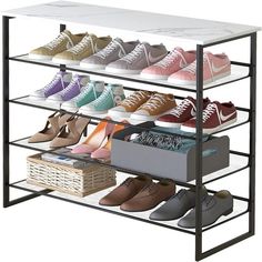 the shoe rack is filled with many pairs of shoes