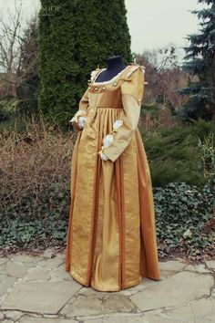 Hey, I found this really awesome Etsy listing at https://www.etsy.com/listing/990136768/renaissance-gown-gold-color-robe Regency Style Medieval Ball Gown, Regency Style Medieval Dress For Costume Party, Medieval Wedding Dress For Medieval Festivals, Medieval Wedding Dress For Historical Festivals, Elegant Floor-length Medieval Dress For Festivals, Elegant Floor-length Medieval Dress, Vintage Medieval Dress For Theater, Medieval Ball Gown Costume Dress, Vintage Medieval Dress For Fancy Dress