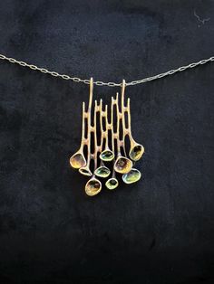 A fabulous bronze necklace by the Modernist Finnish designer Hannu Ikonen for Valo-Koru, Finland. It is from his series named Renmoosblüte  which means Reindeer Moss. It is sculpted from fine bronze and is rare as it has green and gold glass enamel within the cups. The bronze chain has been replaced in the past but adheres to the principles of the original design and works beautifully with it. It is a great example of 1970's Modernist jewellery from Finland, by a highly respected designer. A stu Handmade Brass Modernist Jewelry, Handmade Modernist Brass Jewelry, Modernist Gold Brass Jewelry, Gold Brass Modernist Jewelry, Vintage Bronze Hand-cast Necklaces, Vintage Bronze Hand Cast Necklaces, Vintage Hand-cast Bronze Necklaces, Vintage Hand Cast Bronze Necklaces, Hand Cast Gold Metal Necklace