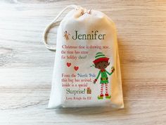 a personalized christmas stocking bag with an elf on it