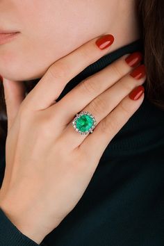 For Sale on 1stDibs - This amazing ring is unique and well thought out before Emilio designed it! Most women today want a ring that is striking, yet humble enough to wear to Formal Emerald Halo Ring Fine Jewelry, Formal Emerald Halo Ring With Round Cut, Formal Emerald Ring With Halo, Formal Emerald Ring With Halo And Round Cut, Elegant Gia Certified Emerald Cluster Ring, Elegant Emerald Rings With Halo, Elegant Emerald Ring With Halo, Luxury Formal Emerald Ring With Halo Design, Luxury Emerald Ring With Halo And Round Cut