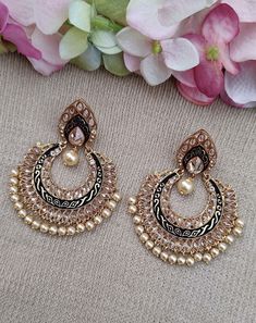 Sparkle your look with these stunning Black and Gold plated Kundan Meenakari Chandbalis. These classic earrings feature beautiful gold and black plating and are secured with a post and back. Crafted from premium alloy and set with lustrous Kundan stones, these earrings are sure to add a touch of sophistication to any look. Features: - Gold and black plating  - Crafted from premium alloy - Set with lustrous Kundan stones - Secured with a post and back Chandbalis Earrings, Diamond Danglers, Jaipur Jewelry, Heavy Earrings, Dangler Earrings, Classic Earrings, American Diamond, Gorgeous Earrings, High Quality Jewelry