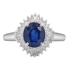 2.26-carat deep blue sapphire, surrounded by 0.54 carats of sparkling diamonds in a timeless ballerina-style setting. Details: Metal: Platinum Size: 8 (adjustable) Weight: 7.62 Grams   Center Gemstone Details: Type: Sapphire Carat: 2.26 Color: Blue Cut: Oval Cut Dimension: 8.5 x 7.3 mm   Side Stones Details: Type: Diamond Cut: Round Cut Carat: 0.54 CTTW Boho Chic Engagement Ring, Vera Wang Engagement Rings, Purple Engagement Rings, Red Engagement Ring, Art Nouveau Engagement Ring, 18k Gold Engagement Ring, Citrine Ring Engagement, Tanzanite Engagement Ring, Garnet Engagement Ring