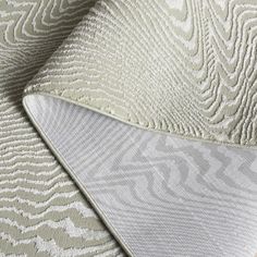 an upholstered mattress with white and grey patterns