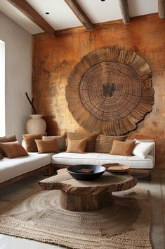 the living room is decorated in wood and has a large tree slice on the wall